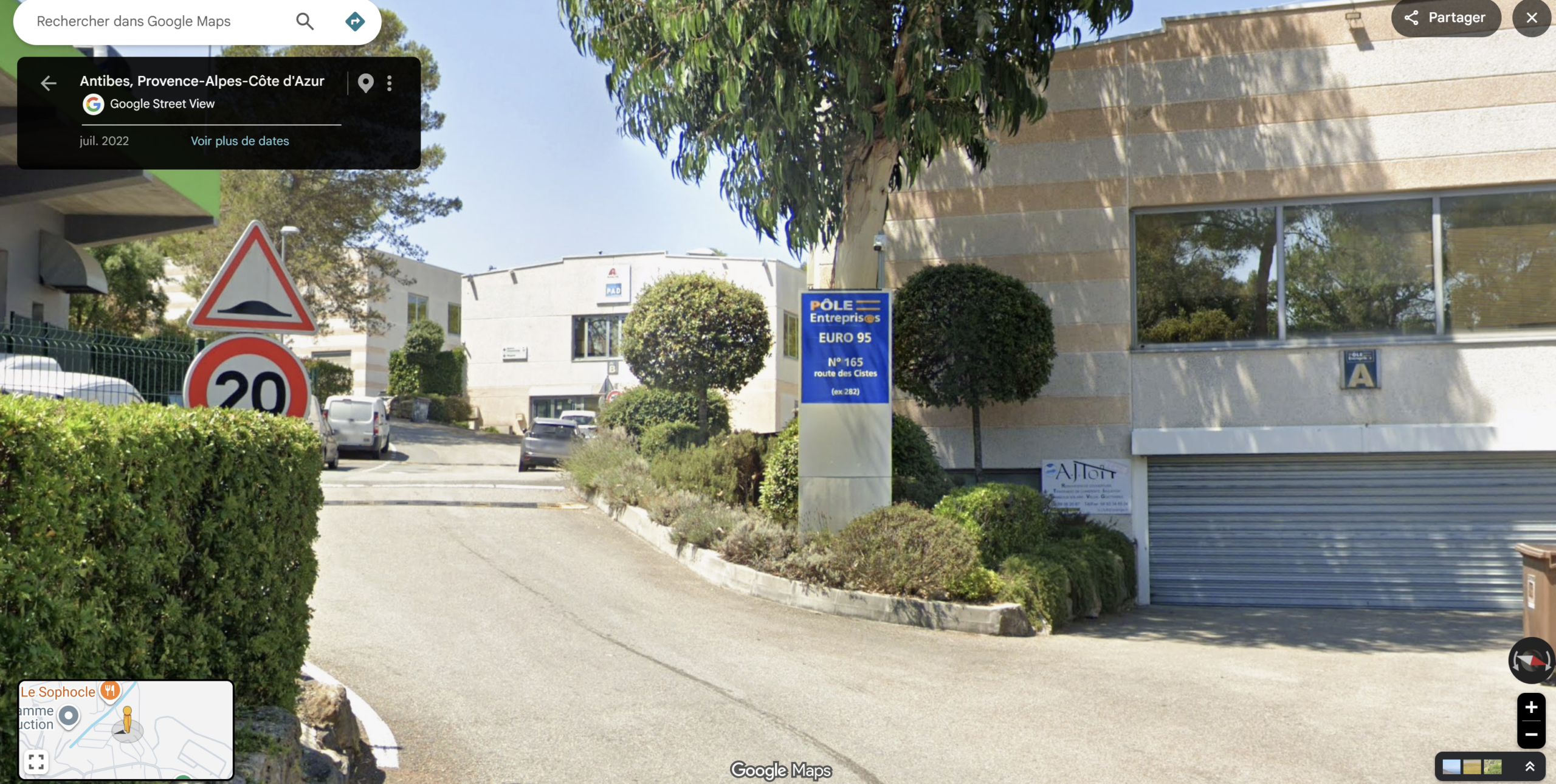 Correct entrance up close: driveway beside the blue Pôle Entreprises Euro 95 totem sign
